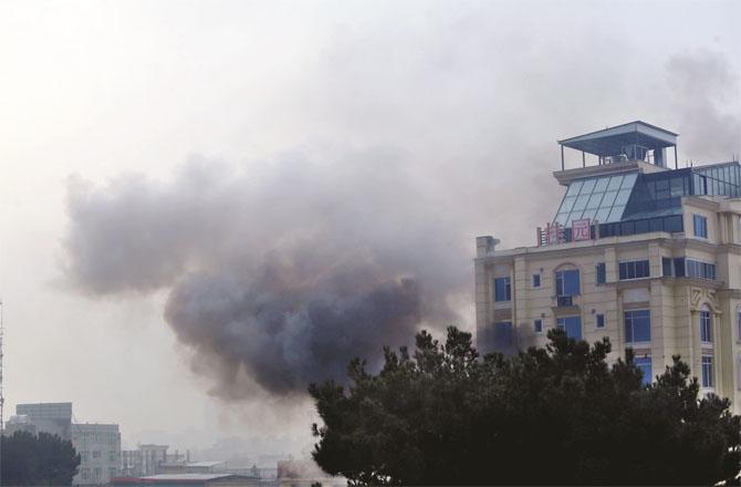 Smoke can be seen billowing out of a building in Kabul after an explosion